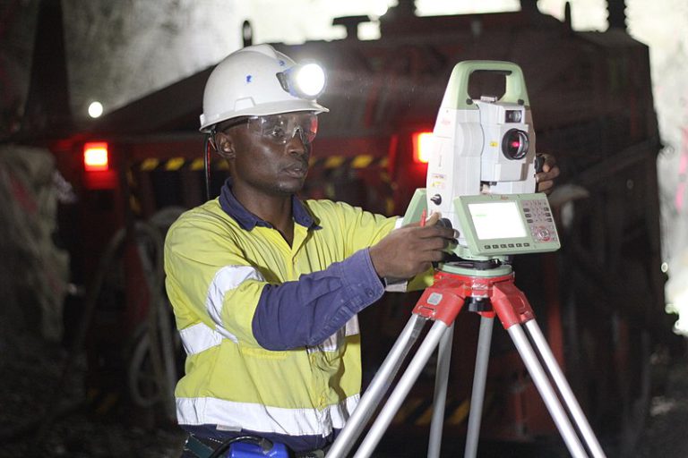 Photograph of a surveyor collecting underground 3D mapping data via the traditional approach.